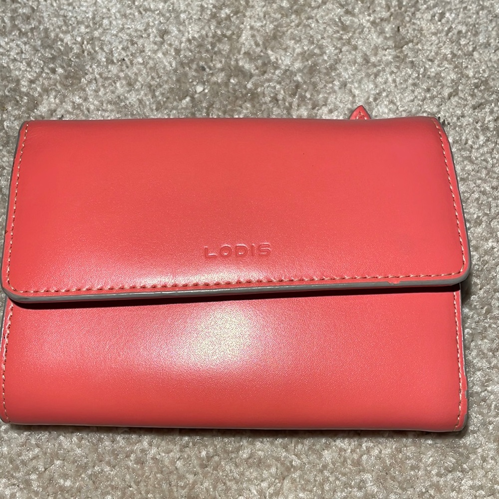 Small red wallet by Lodis.